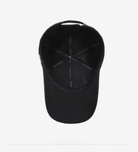 Detail view of the black baseball cap interior with narason logo tape and reinforced seams