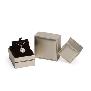 Golden faux leather jewelry box set for necklaces and rings with brushed metal finish