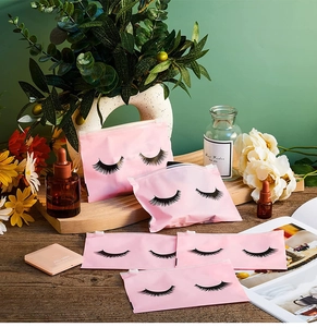 Detailed view of five pink EVA eyelash bags with black zipper and eyelash pattern