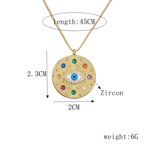 Macro detail of gold-plated evil eye disk necklace with zircon and size specifications