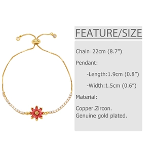 Close-up of golden daisy bracelet with red zircon petals and adjustable slider bead