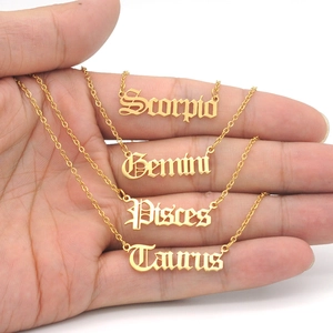 Gothic style gold zodiac necklaces featuring Scorpio, Gemini, Pisces and Taurus charms