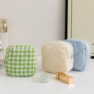 Three large capacity sanitary pad storage bags in corduroy and plaid fabric textures