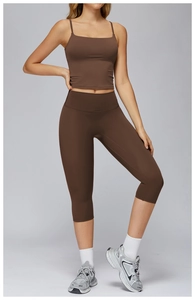 Detail of brown yoga set with spaghetti strap tank top and high waist capri leggings