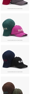 Detailed macro view of vintage distressed baseball cap featuring BLACK letter embroidery