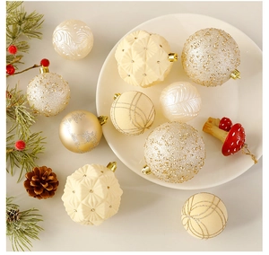 Detailed view of beige and gold Christmas balls with velvet and glitter textures