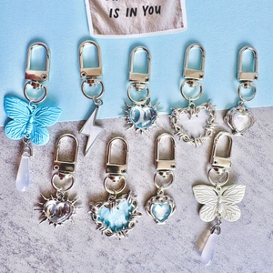Collection of creative butterfly and heart metal keychains with blue and silver charms