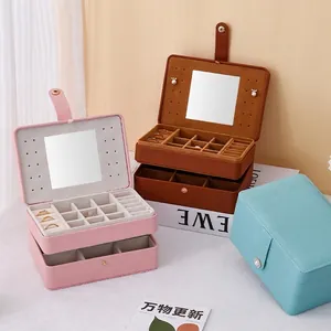 Multi-tier vintage jewelry organizer with mirror in pink, brown, and cyan PU leather