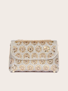 Detailed view of sun flower crystal beading and gold chain on beige evening clutch bag