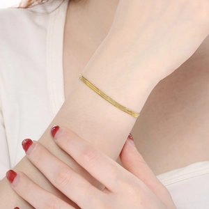 Minimalist 18K gold plated stainless steel snake bone chain bracelet worn on wrist