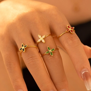 18k gold plated clover rings with colorful zircon stones on model's fingers