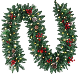 Close-up of 2.7m Christmas garland with LED lights, pine cones and red berries on white