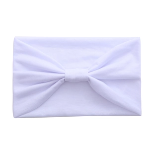 Wide white cotton yoga headband with a twist knot design for sports and fashion wear