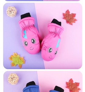 Close-up of waterproof cartoon dinosaur ski mittens for kids with pink and blue options