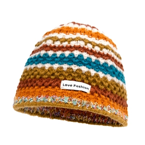Rainbow knit beanie for women featuring a retro colorful striped design and fashion label
