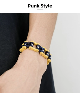 Close-up of punk style bicycle chain bracelet with bold yellow and blue contrast design