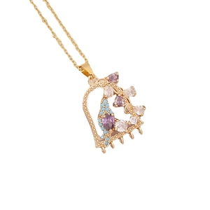 Golden heart necklace with colorful zircons in purple, white, and blue tones