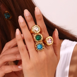 Chunky 18K gold plated rings featuring large emerald and sapphire square cut gemstones