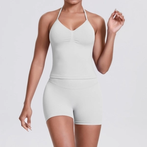 Detail of ribbed texture and seamless stitching on white halter yoga set for women