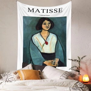 Detail of Matisse art tapestry hanging over a bed in a minimalist bedroom setting