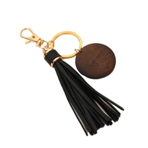 Wooden MAMA engraved keychain featuring a black PU leather tassel and gold metal hardware