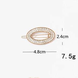 Detail view of rhinestone gold duckbill clip with dimensions 4.8cm and 2.4cm