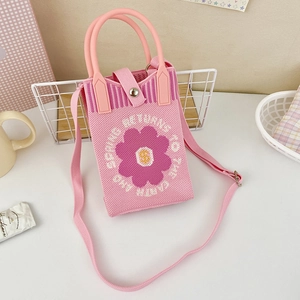 Pink knitted phone bag with flower pattern and detachable shoulder strap detail
