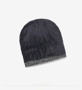 Detailed view of thick gray fleece lining on a winter knitted beanie for cold protection