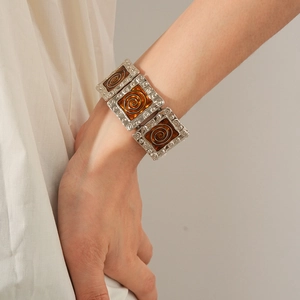 Detail of vintage square enamel bracelet with amber resin inlay and antique silver finish