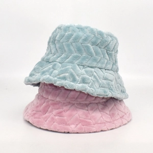 Detail of pink and light blue plush bucket hats with embossed chevron texture pattern