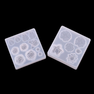 Macro shot of transparent silicone flower and leaf molds for DIY resin jewelry making