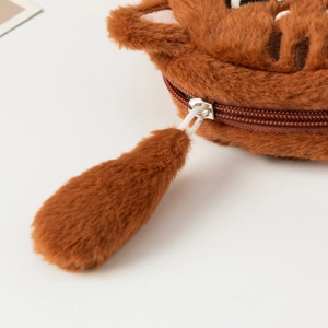 Detail of soft plush cat coin purse with furry tail zipper pull and fine fur texture