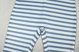 Close-up of blue and white striped knit jumpsuit showing fabric texture and neat seams