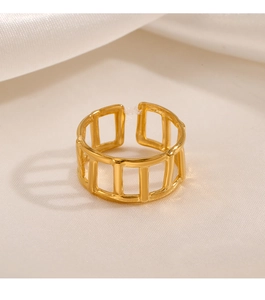 Macro view of geometric open-ring with 18K gold plating on textured white satin