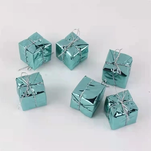 Close-up of set of six teal blue metallic foil gift box ornaments with silver strings