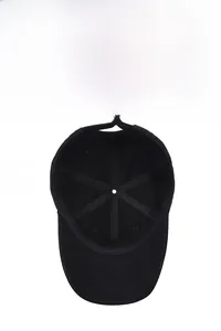 Detail of internal cotton structure and embroidered logo on black baseball cap