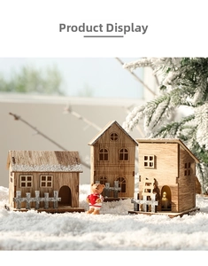 Detailed view of laser-cut wooden Christmas cottages and a mini teddy bear ornament