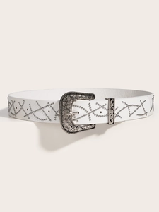 Detail of white leather belt featuring silver engraved buckle and punk rivet patterns
