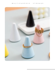 Macro detail of colorful ceramic cone ring holders in minimalist macaron pastel finishes