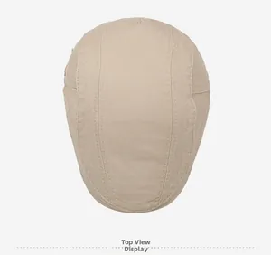 Top view of beige cotton beret showing reinforced stitching and premium fabric texture