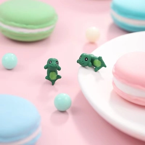 Cute green mini dinosaur stud earrings for women with detailed matte resin finish