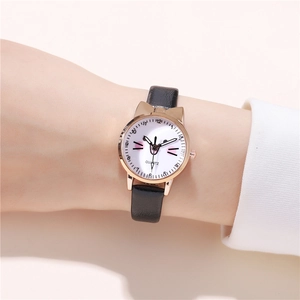 Close-up of cute cat-ear rose gold quartz watch with pink cat face dial on wrist