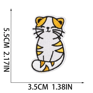 Detail view of cartoon cat embroidery patch with height and width measurements