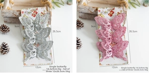 Detailed size view of glittery Christmas butterfly ornaments on display packaging