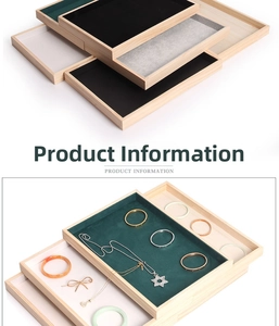 Detailed view of wood jewelry tray with velvet lining for rings and necklaces