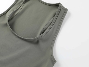 Close-up of olive green square neck tank top showing precise stitching and elastic fabric