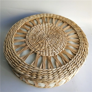 Close-up of the radial weaving pattern on a natural straw round tatami seat cushion