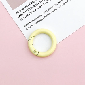 Macro shot of 25mm cream yellow spring ring clasp for DIY jewelry chains