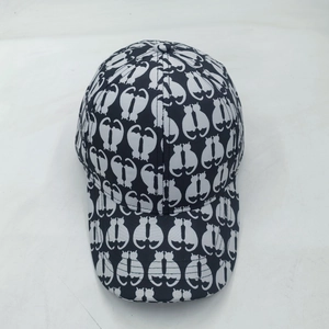 Adult black and white baseball cap featuring repeating cat silhouette print and curved brim