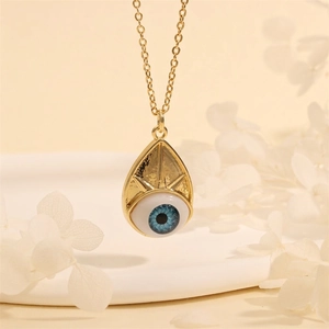 Macro shot of 18K gold plated teardrop Evil Eye pendant with blue eye inlay detail